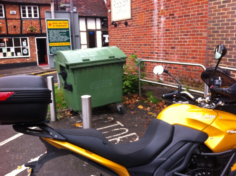 Grundon green bin in motorcycle parking bay